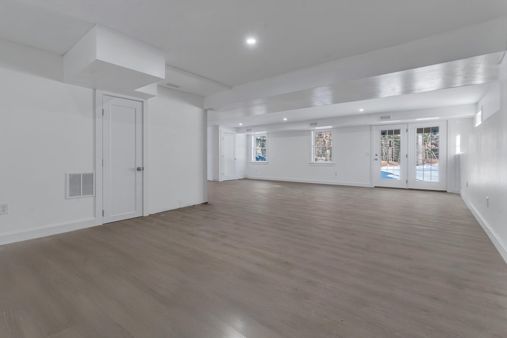 25 Columbine Road Rehoboth, MA 02769 - Photo 36 of 42 a view of an empty room with wooden floor and a window