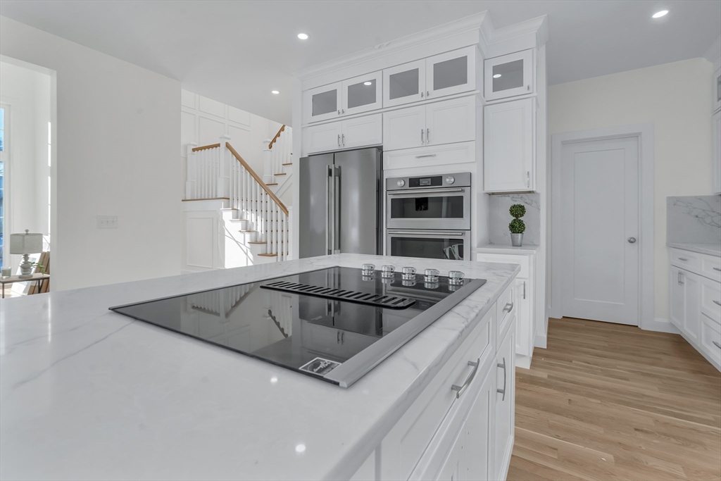 25 Columbine Road Rehoboth, MA 02769 - Photo 4 of 42 a kitchen with stainless steel appliances granite countertop a sink and a stove