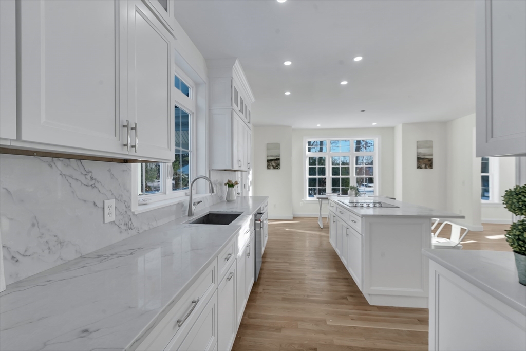 25 Columbine Road Rehoboth, MA 02769 - Photo 6 of 42 a large white kitchen with lots of counter space and windows