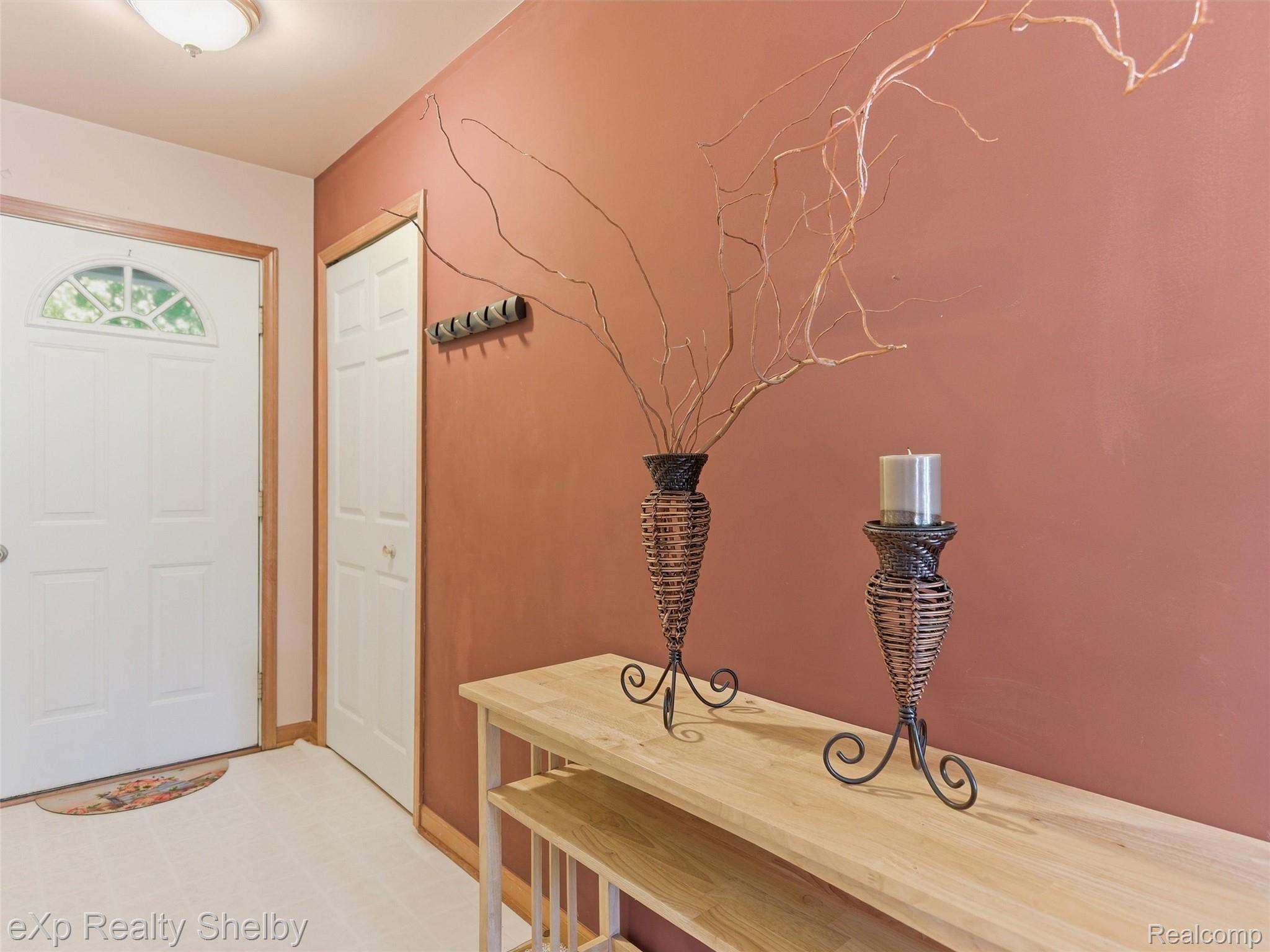4154 Union Street Dryden, MI 48428 - Photo 5 of 41 Entryway featuring a white paneled door with an arched window, light wood-finish trim, a recessed ceiling light, and light-colored carpet flooring
