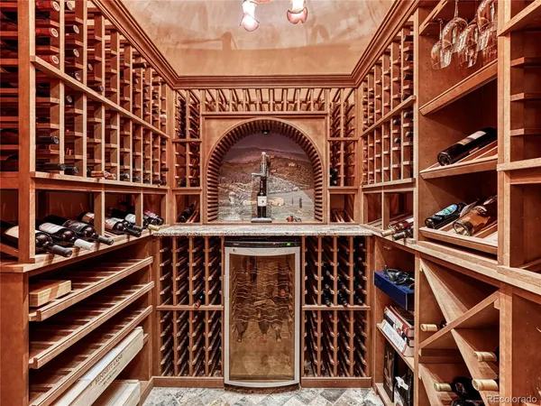 a view of a garden with a table and chairs under an umbrella