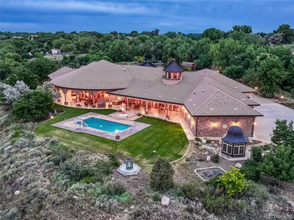 a view of a patio with a dining table and chairs with a patio