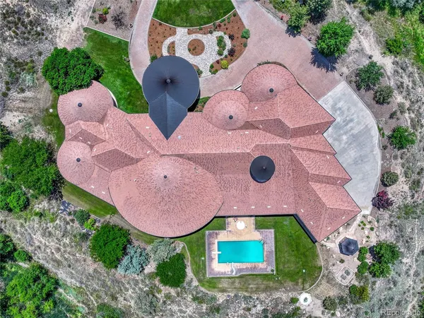 a spacious bathroom with a granite countertop double vanity sink and a large mirror