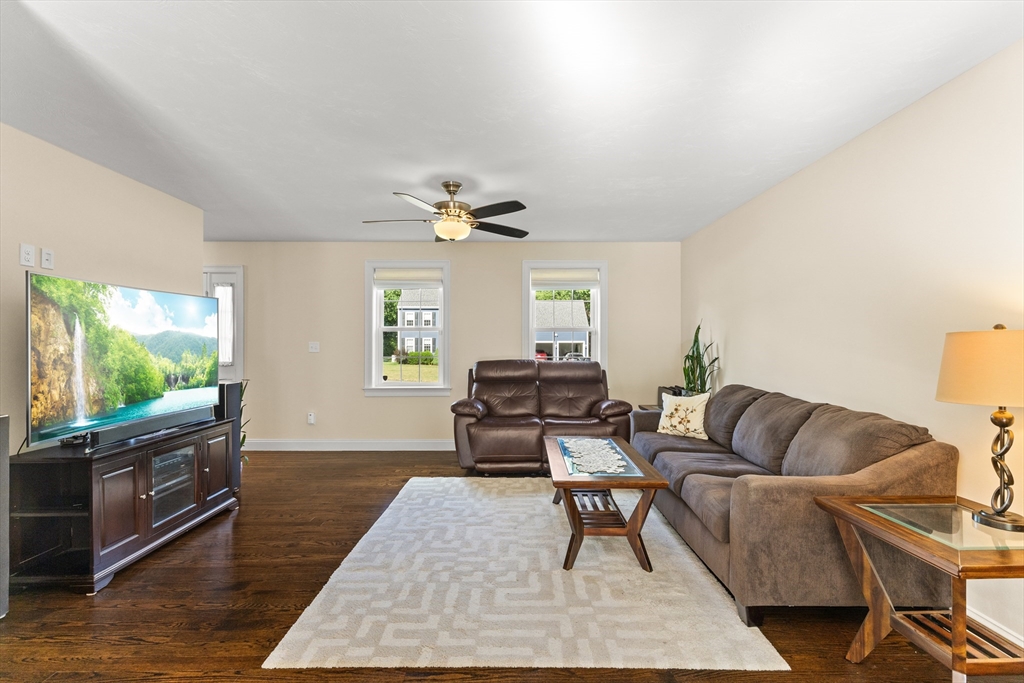 15 Carlton Street Raynham, MA 02767 - Photo 15 of 34 a living room with furniture and a flat screen tv