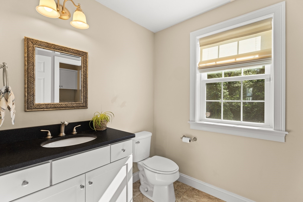 15 Carlton Street Raynham, MA 02767 - Photo 19 of 34 a bathroom with a sink vanity and a toilet