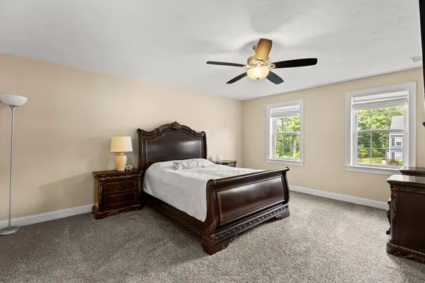 a bedroom with a bed and window