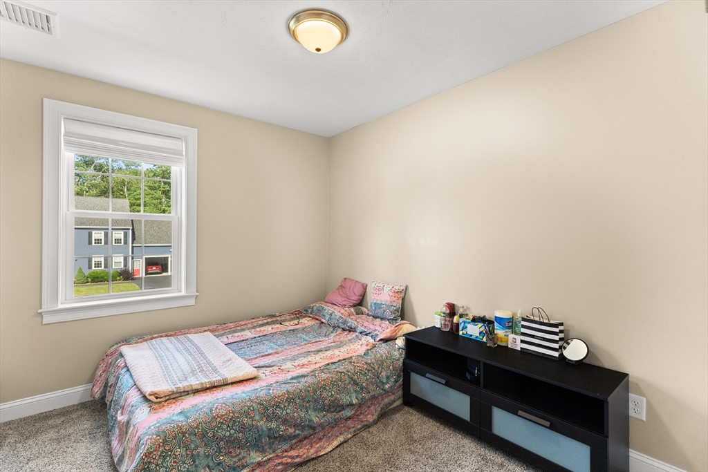 15 Carlton Street Raynham, MA 02767 - Photo 27 of 34 a bedroom with a bed and a window