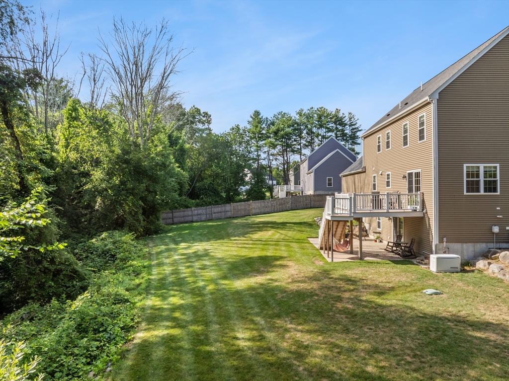 15 Carlton Street Raynham, MA 02767 - Photo 3 of 34 a view of a house with backyard