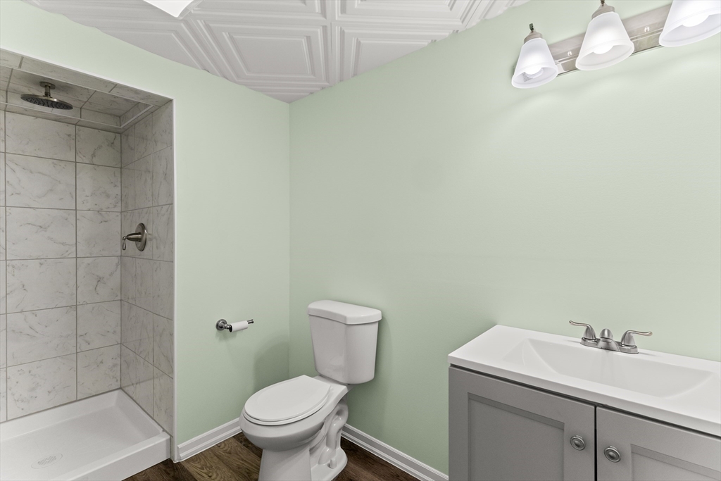 15 Carlton Street Raynham, MA 02767 - Photo 34 of 34 a bathroom with a sink a toilet and a shower