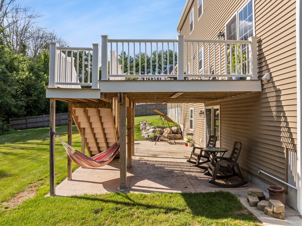 15 Carlton Street Raynham, MA 02767 - Photo 4 of 34 a view of a chairs and tables in the patio