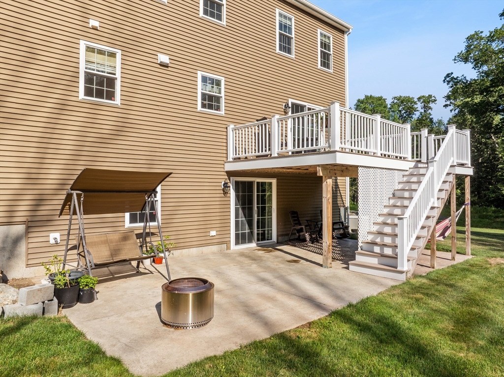15 Carlton Street Raynham, MA 02767 - Photo 6 of 34 a front view of a house with patio