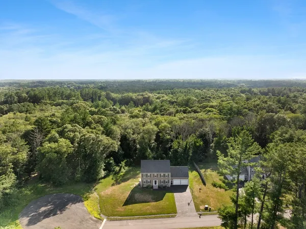 a view of a swimming pool with a yard