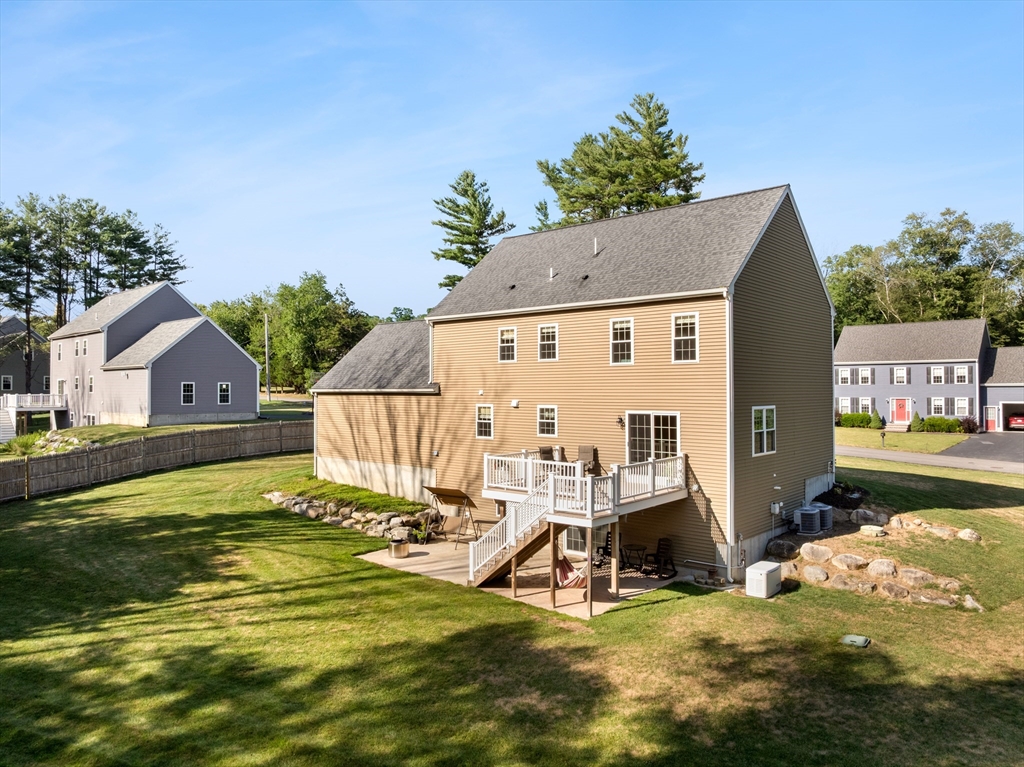 15 Carlton Street Raynham, MA 02767 - Photo 9 of 34 a view of a house with a swimming pool
