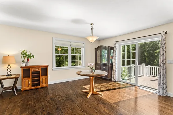a view of a livingroom with furniture window and wooden floor