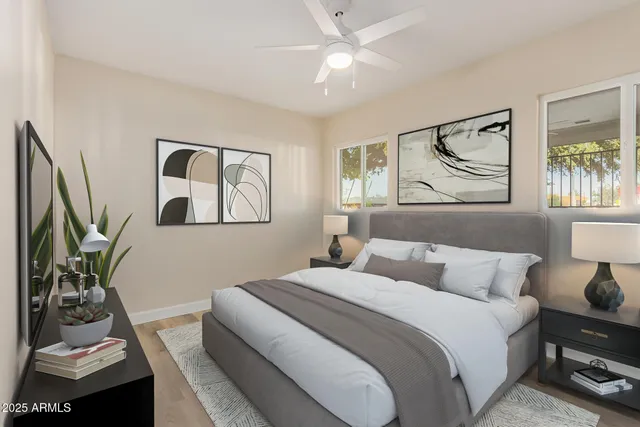 a bathroom with a granite countertop toilet sink and mirror