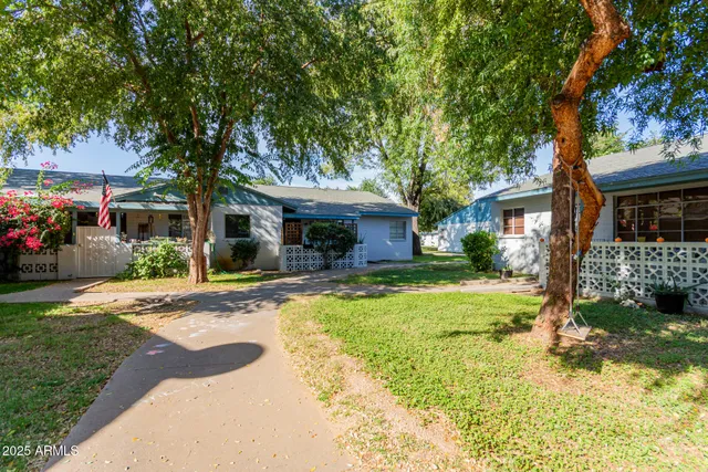 swimming pool view with a garden