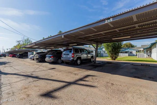 a view of a swimming pool with a garden and trees