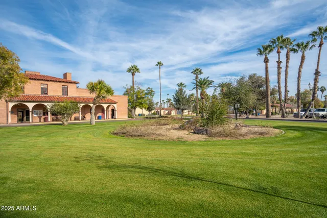 a view of multiple houses with a yard