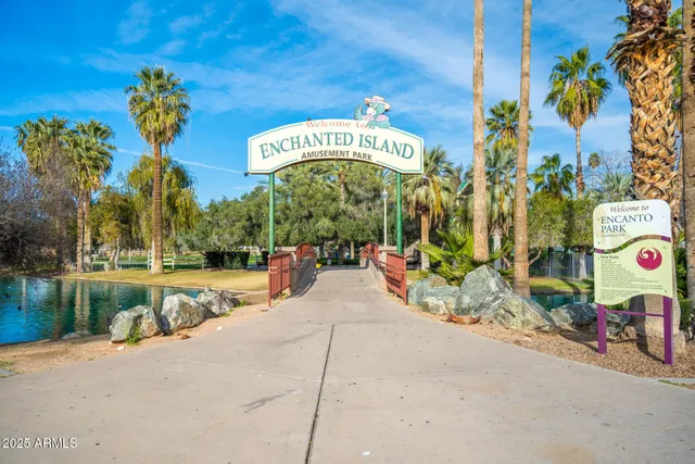 a view of a porch with a table and chairs and potted plants