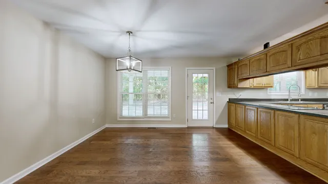 a view of a park with large trees