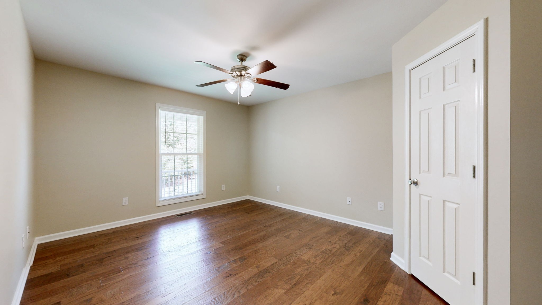 5430 Wiley Hollow Road Culleoka, TN 38451 - Photo 25 of 54 an empty room with wooden floor fan and windows