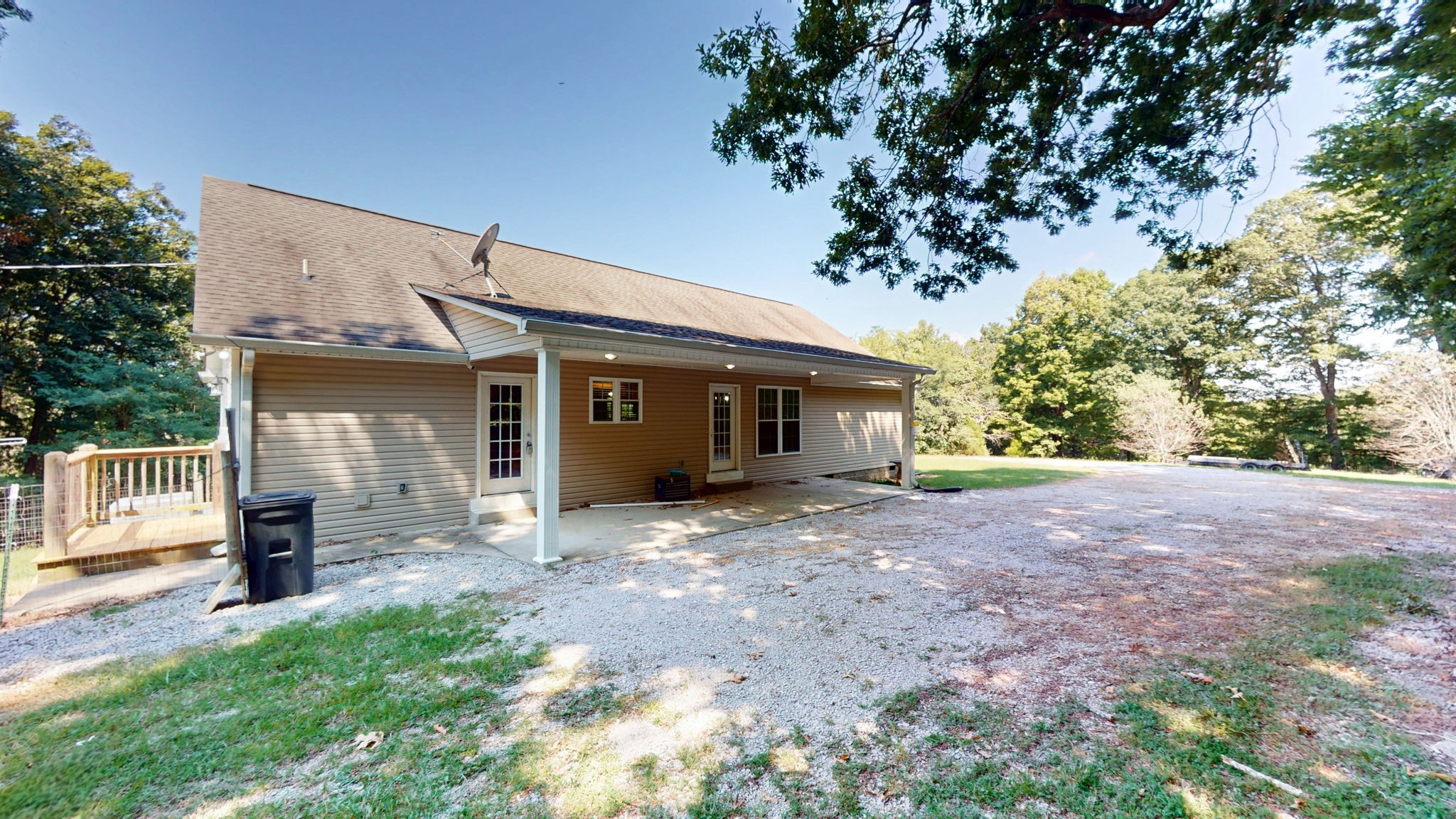 5430 Wiley Hollow Road Culleoka, TN 38451 - Photo 32 of 54 a view of a house with a yard and floor to ceiling window