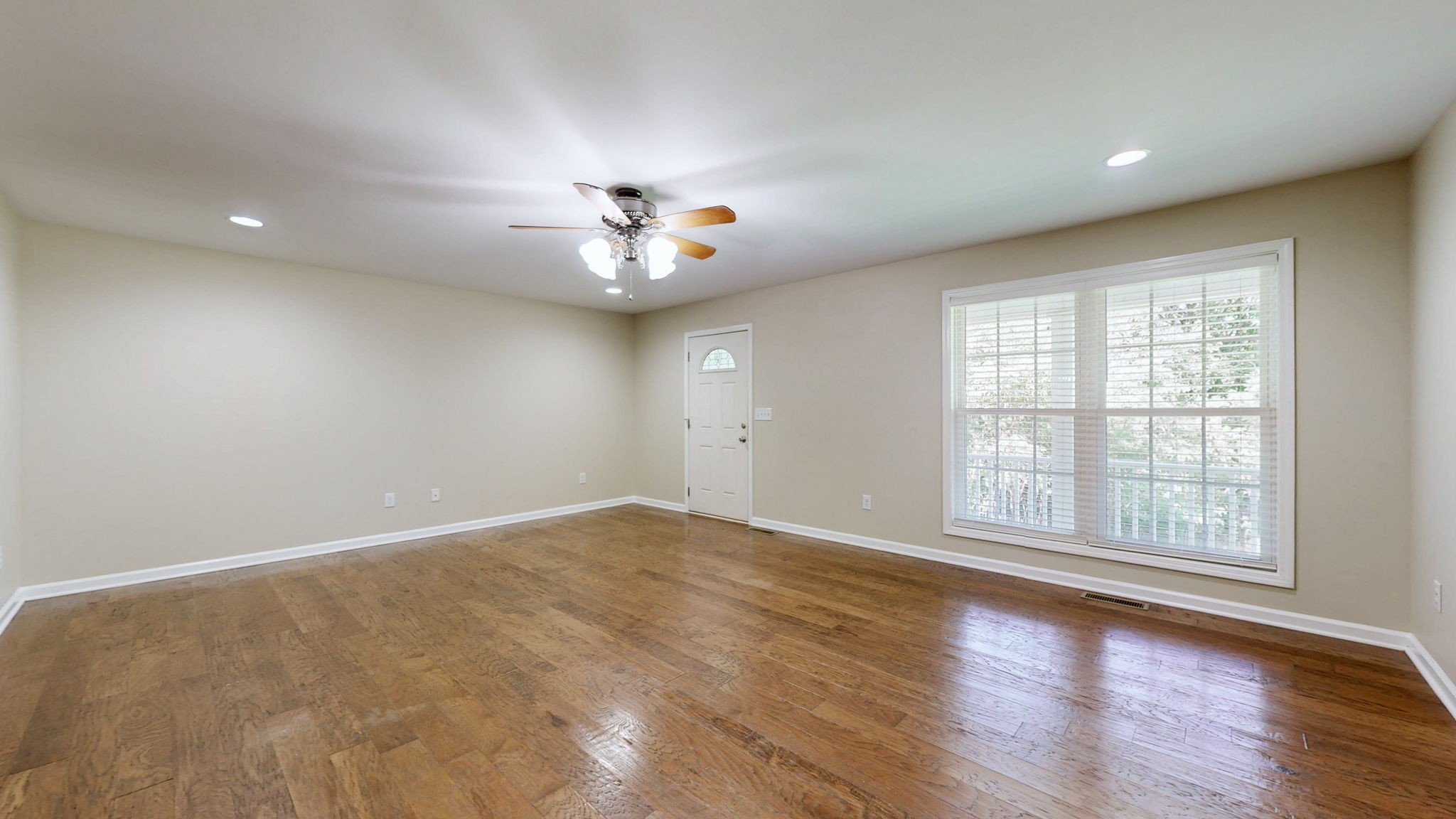 5430 Wiley Hollow Road Culleoka, TN 38451 - Photo 5 of 54 an empty room with wooden floor and windows