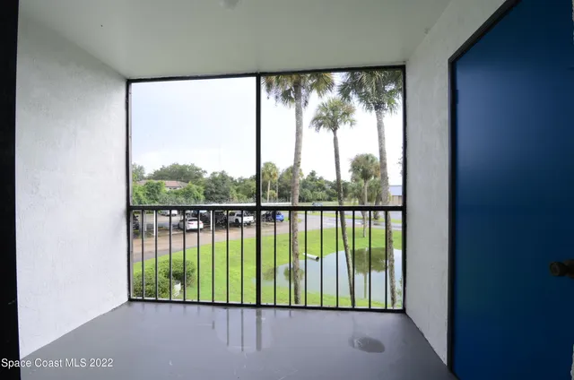 a view of a park with large trees