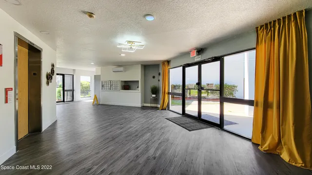 a view of a livingroom with wooden floor