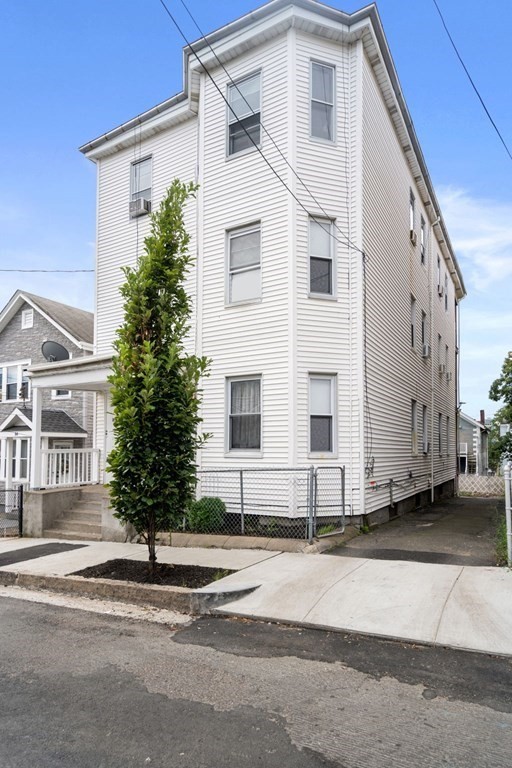 86 Orange Street Chelsea, MA 02150 - Photo 2 of 4 a view of a house with a street