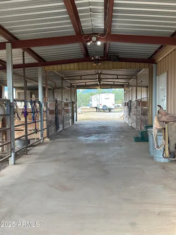 a view of empty room with wooden ceiling