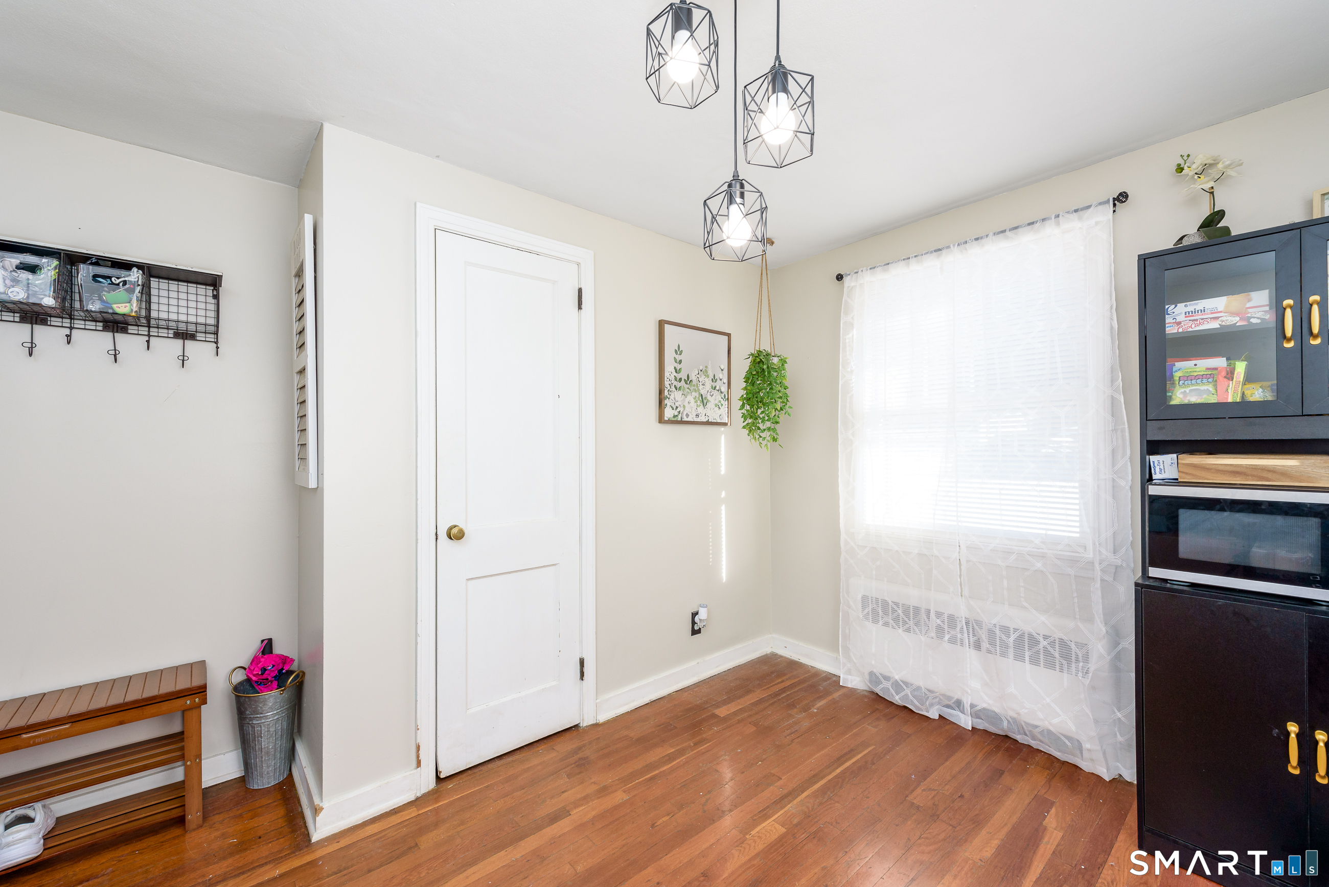 1035 North Worthy Street Windsor, CT 06095 - Photo 11 of 34 a view of empty room with wooden floor and fan