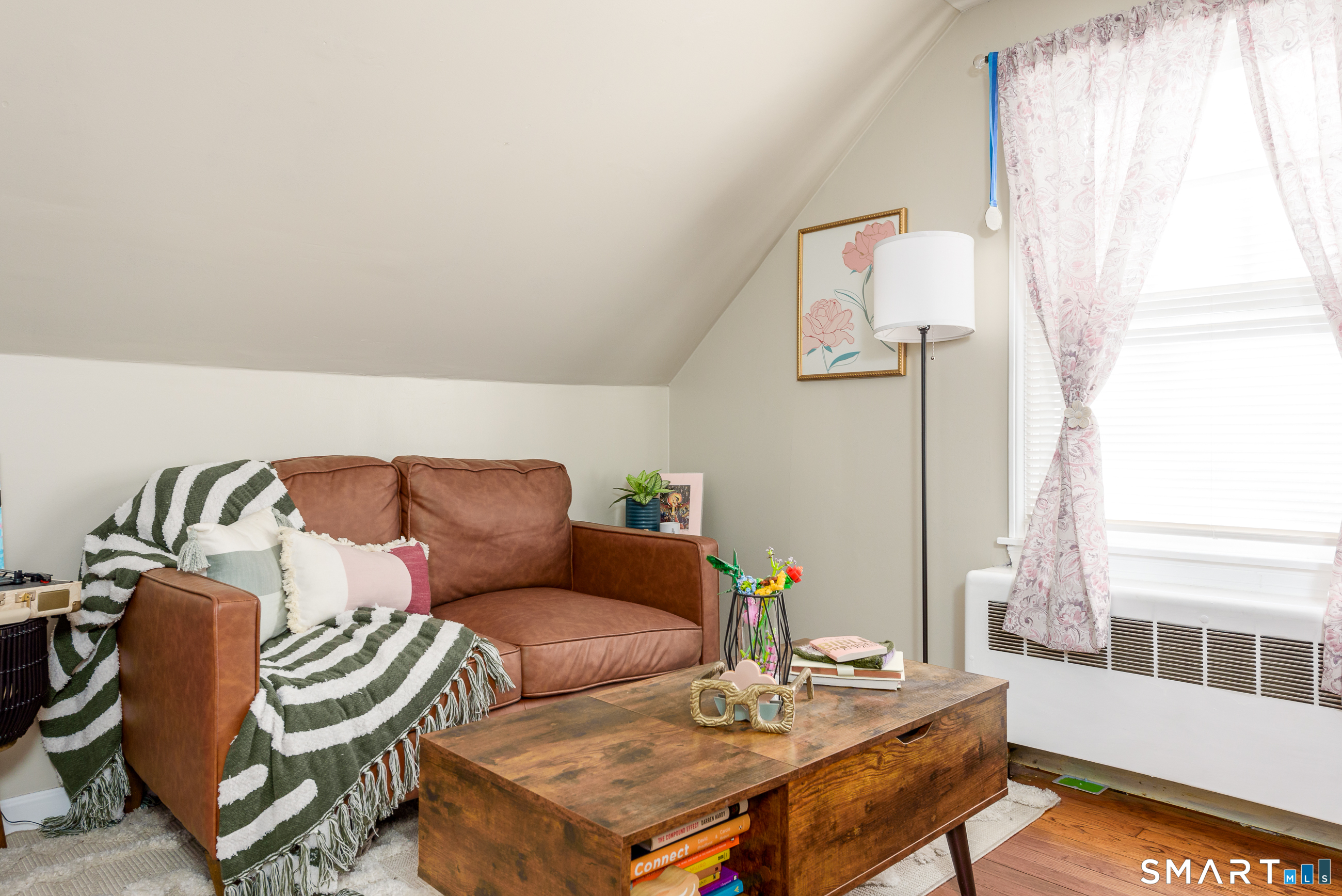 1035 North Worthy Street Windsor, CT 06095 - Photo 13 of 34 a living room with furniture and a window