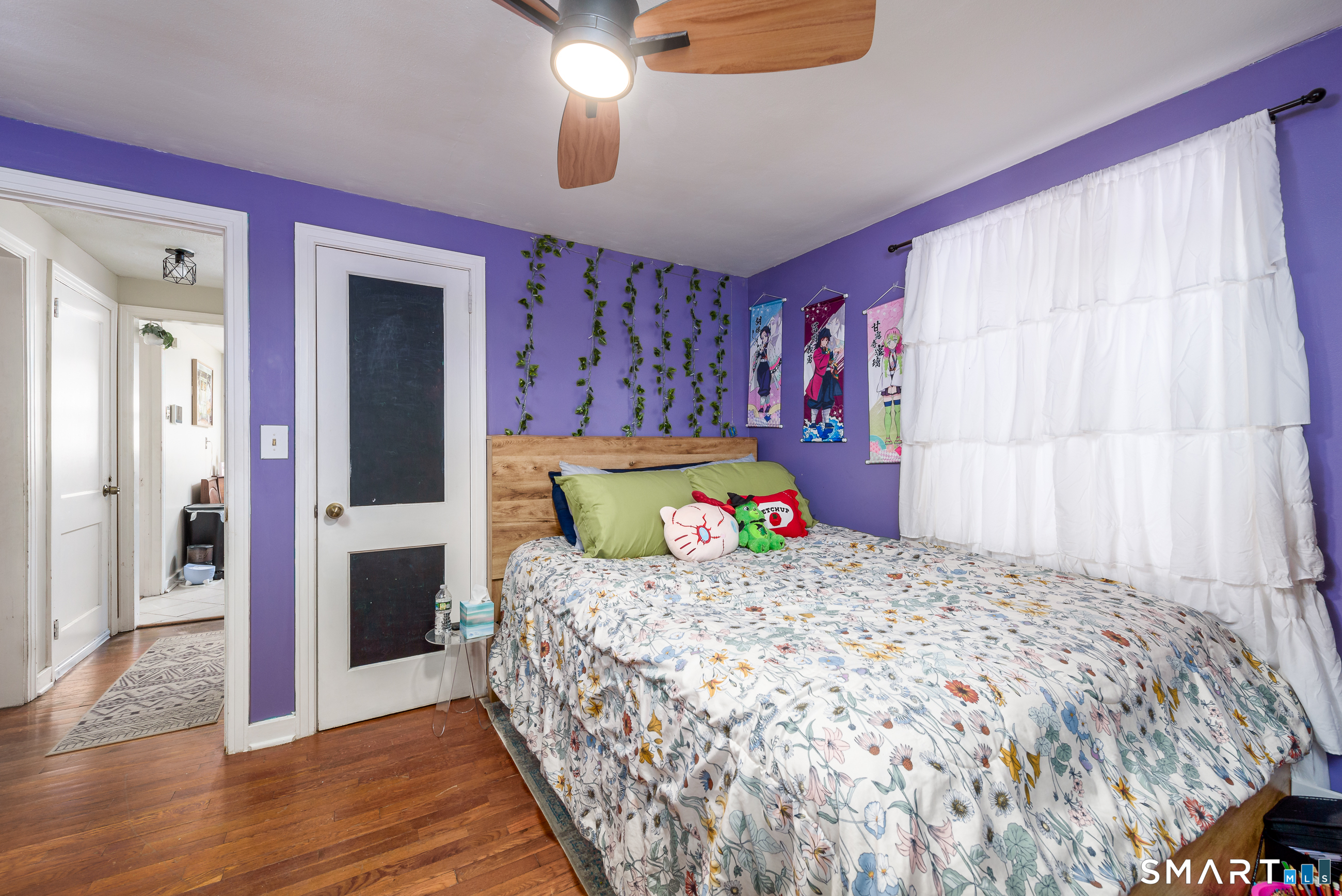 1035 North Worthy Street Windsor, CT 06095 - Photo 18 of 34 a bedroom with a bed and a chandelier