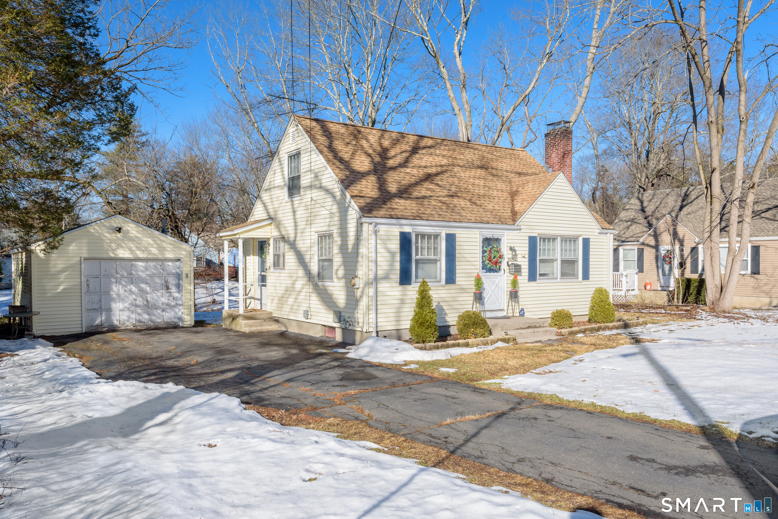 1035 North Worthy Street Windsor, CT 06095 - Photo 5 of 34 a view of a house with snow on the side of the road