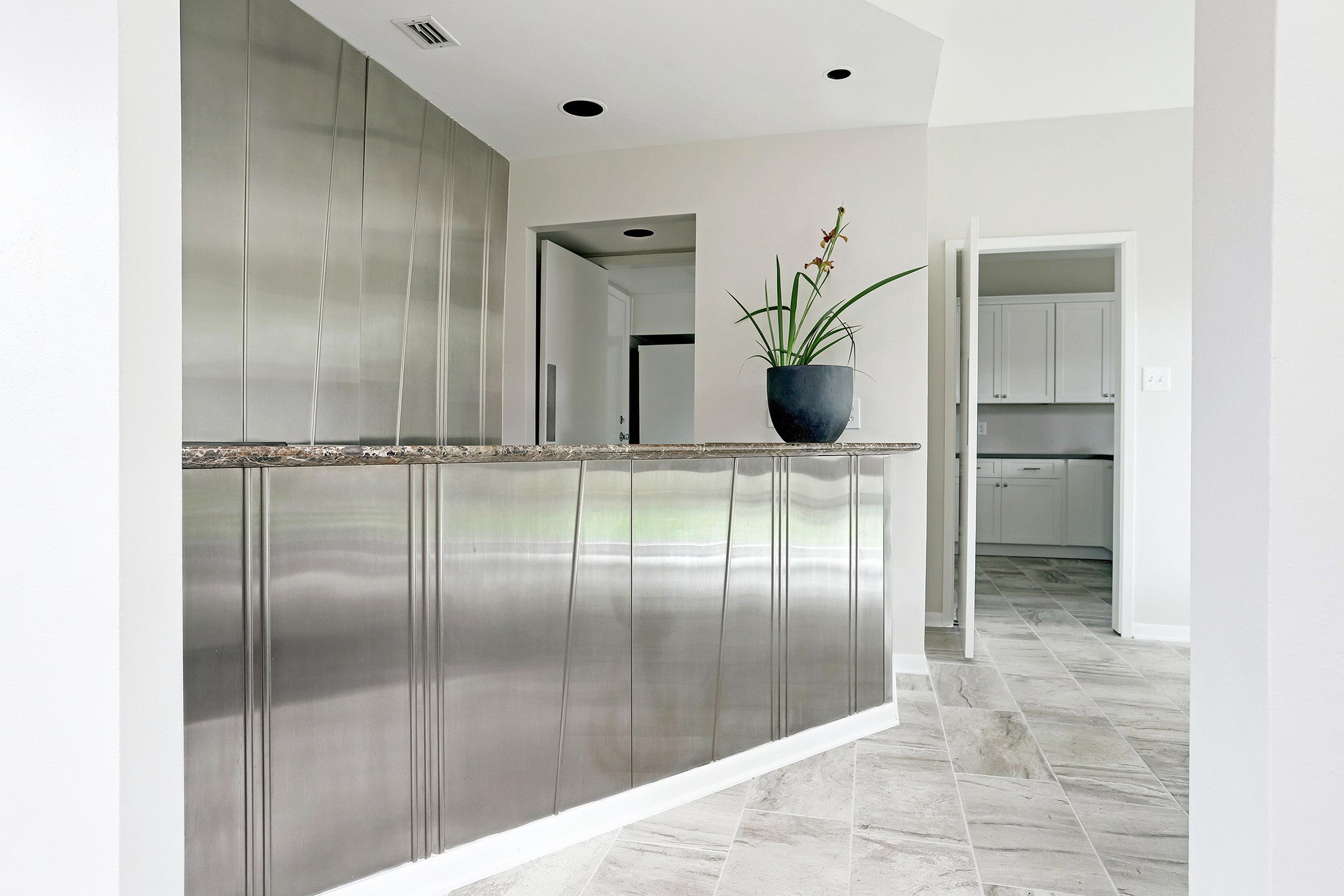 5300 Mercer Street, Unit 9 West University Place, TX 77005 - Photo 9 of 23 The bar leading to the kitchen. The cook may also need a drink!