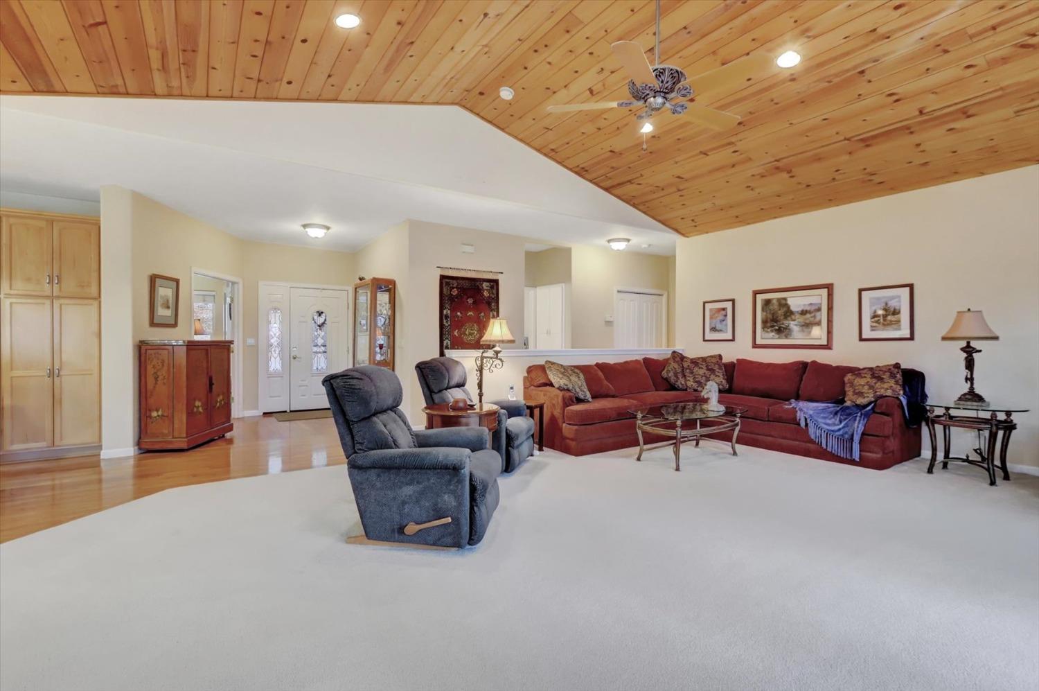 17036 Alice Way Grass Valley, CA 95949 - Photo 9 of 58 a living room with furniture and a chandelier