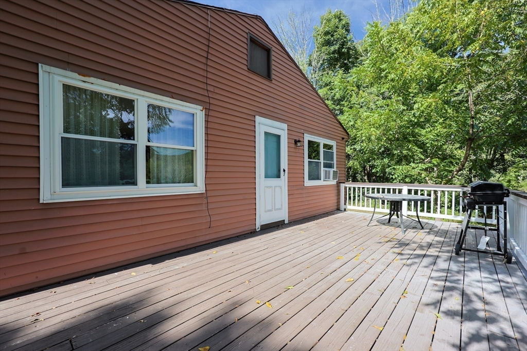 74 Breen Road Hardwick, MA 01037 - Photo 19 of 22 a view of a house with wooden deck