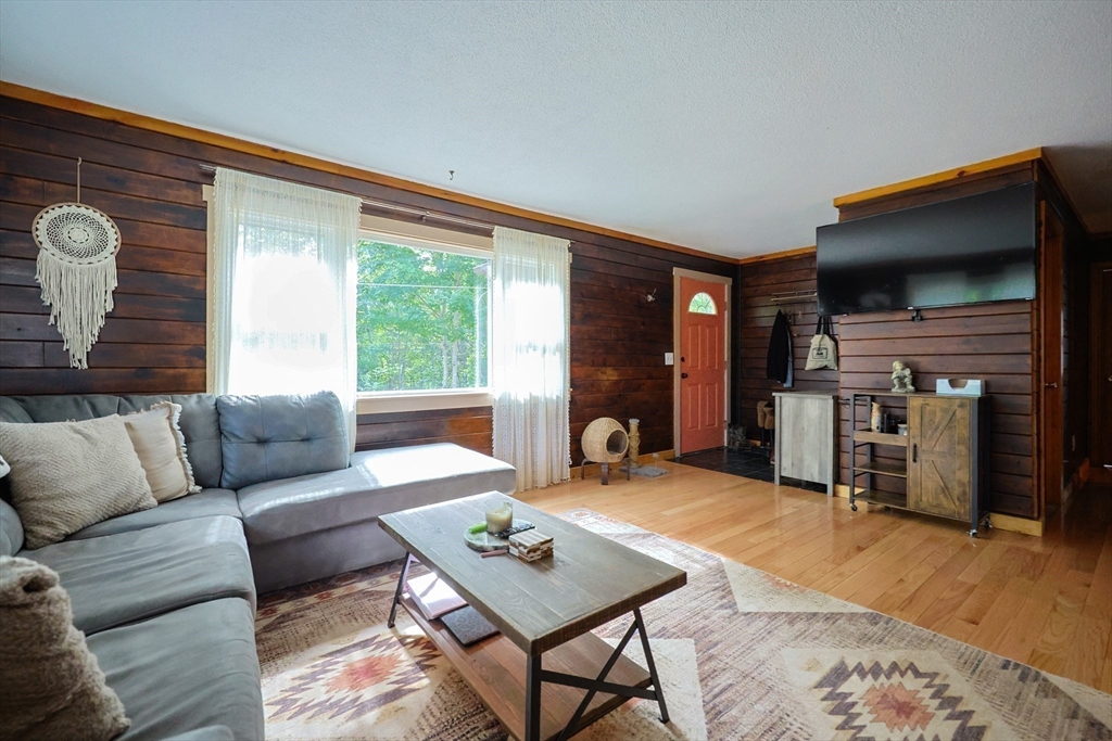 74 Breen Road Hardwick, MA 01037 - Photo 3 of 22 a living room with furniture and a flat screen tv