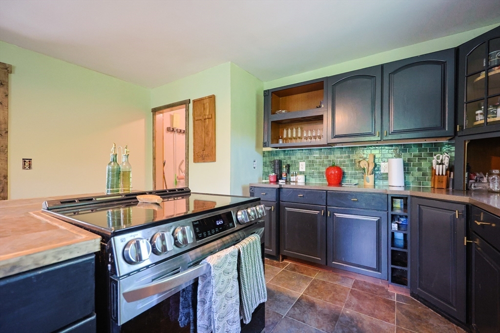 74 Breen Road Hardwick, MA 01037 - Photo 10 of 22 a kitchen with stainless steel appliances granite countertop a stove and a sink