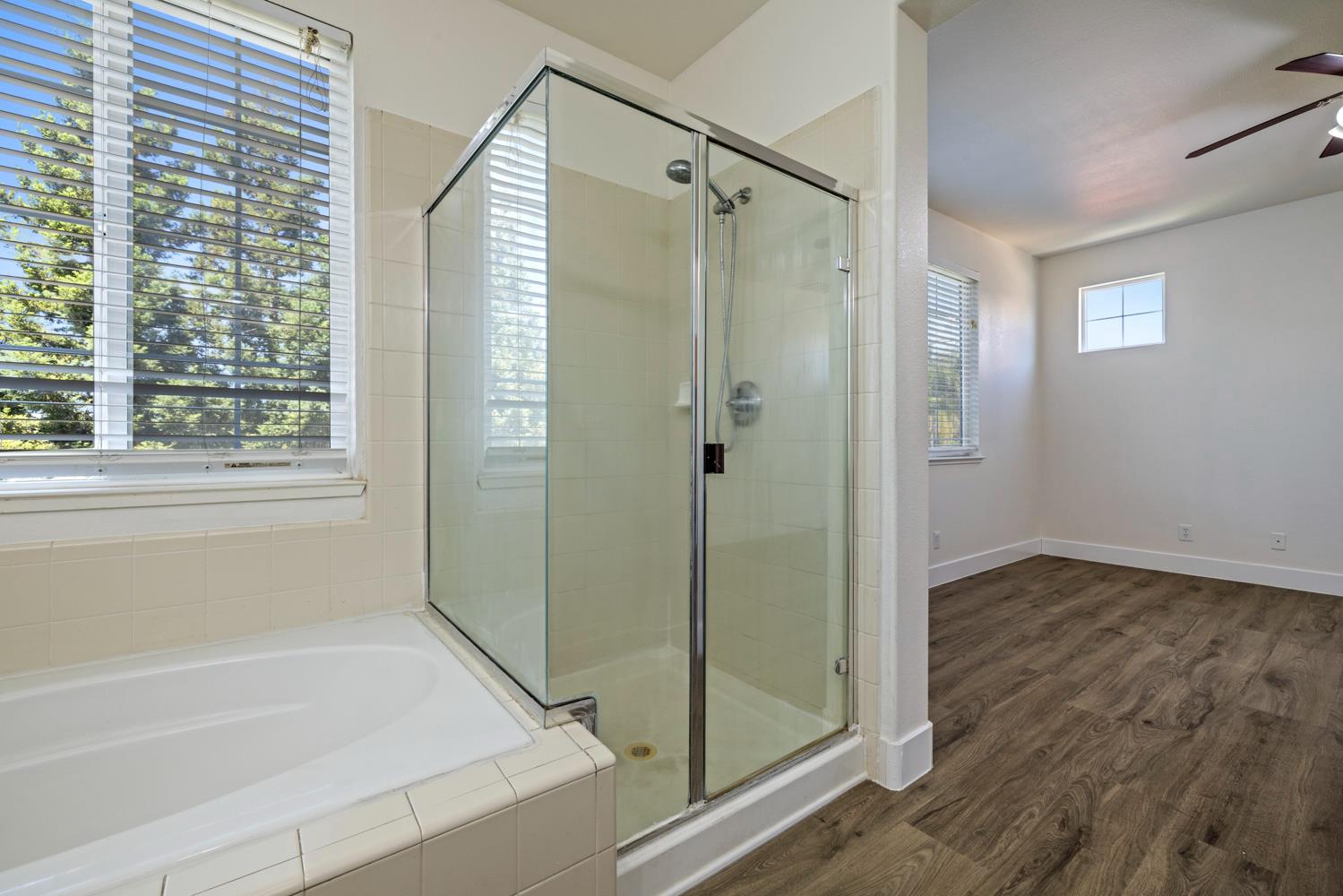 3105 Ripple Court Modesto, CA 95355 - Photo 29 of 46 a bathroom with a shower and a bath tub