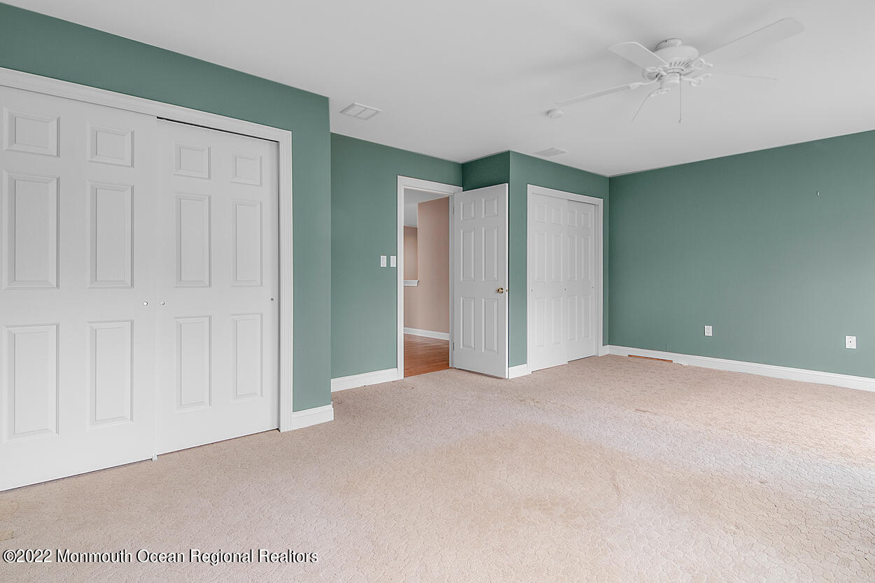 46 Glen Rock Road Cedar Grove, NJ 07009 - Photo 18 of 36 an empty room with closet and fan