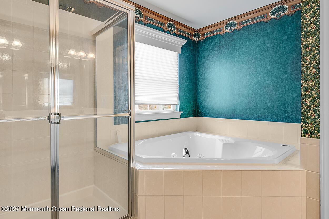 46 Glen Rock Road Cedar Grove, NJ 07009 - Photo 25 of 36 a bathroom with a bathtub and a shower