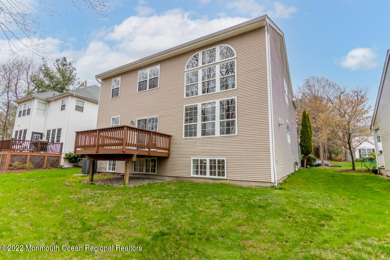 46 Glen Rock Road Cedar Grove, NJ 07009 - Photo 35 of 36 a backyard of a house with table and chairs