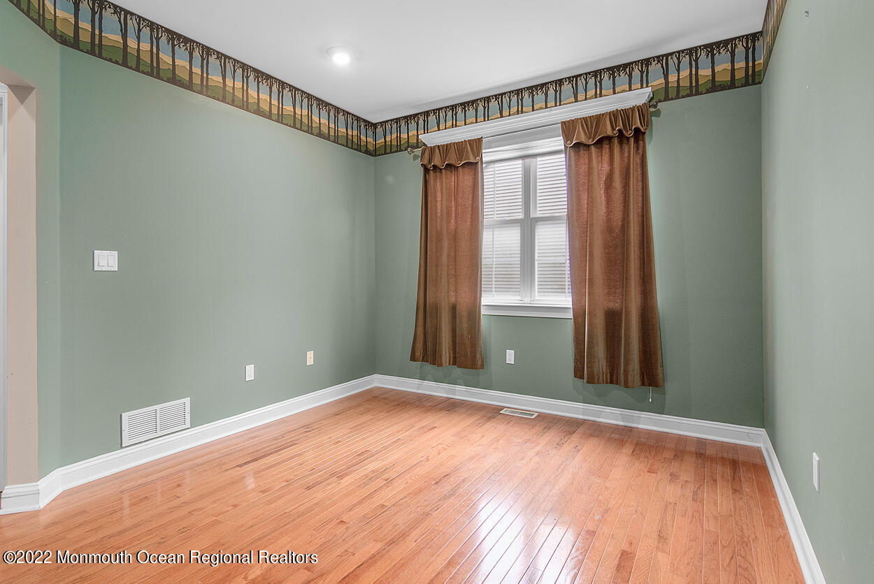 46 Glen Rock Road Cedar Grove, NJ 07009 - Photo 7 of 36 a view of a room with wooden floor and windows