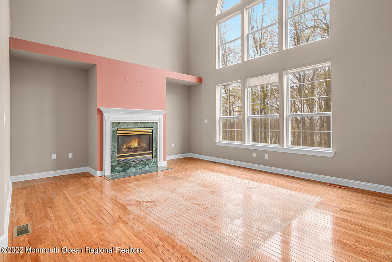 46 Glen Rock Road Cedar Grove, NJ 07009 - Photo 9 of 36 a view of an empty room with window and fire place