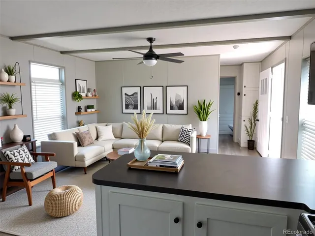 a living room with furniture and a chandelier
