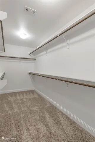 a view of an empty walk in closet