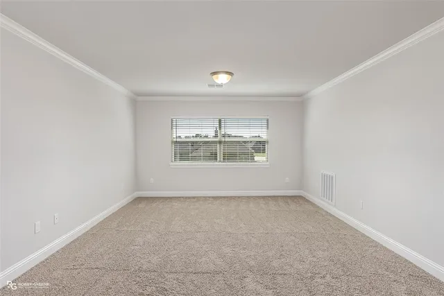 an empty room with a empty space and windows