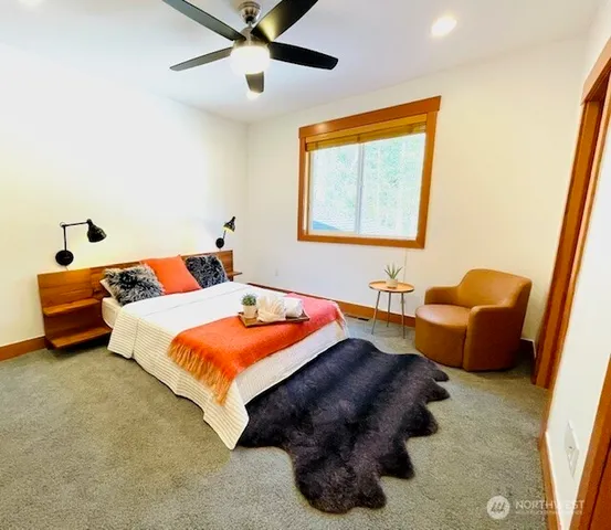 a bedroom with bed and window